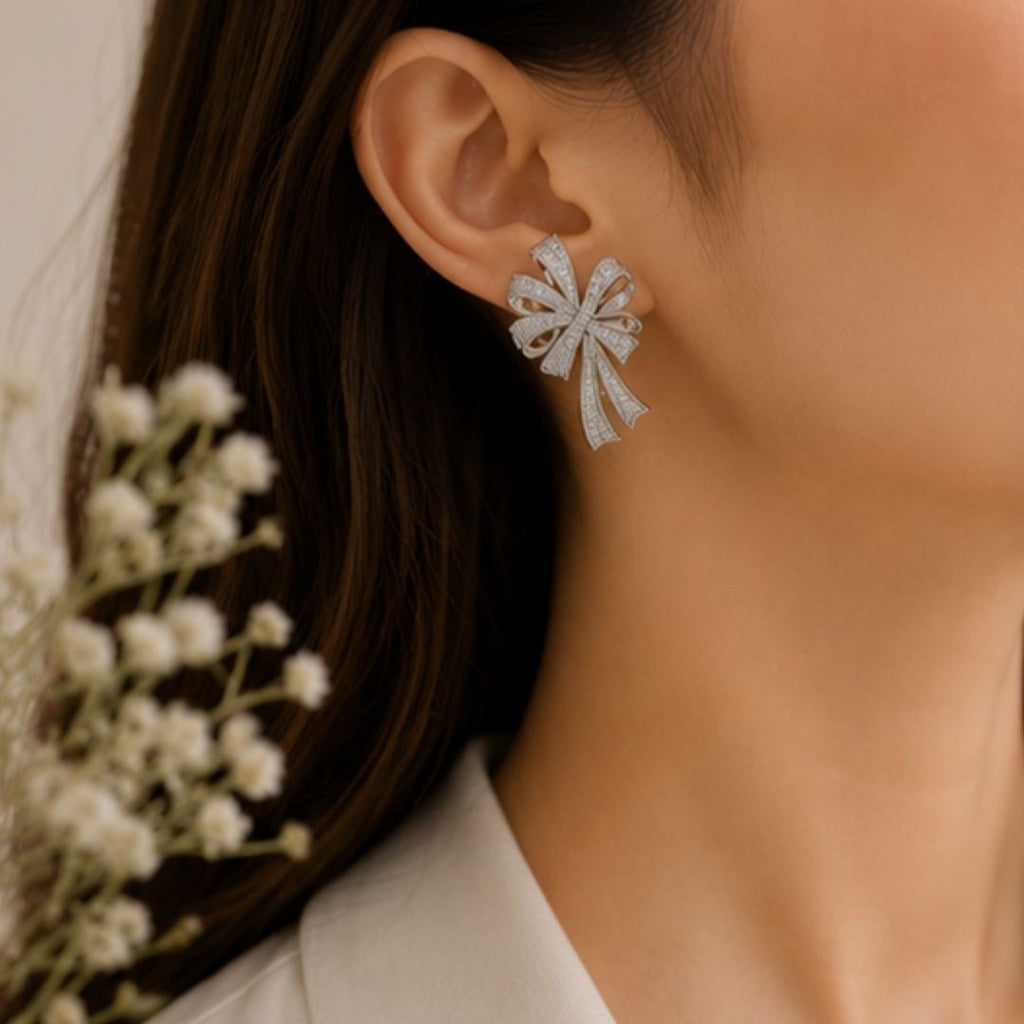 Rhodium Plated Cubic Zirconia Bow Style Drop Earrings