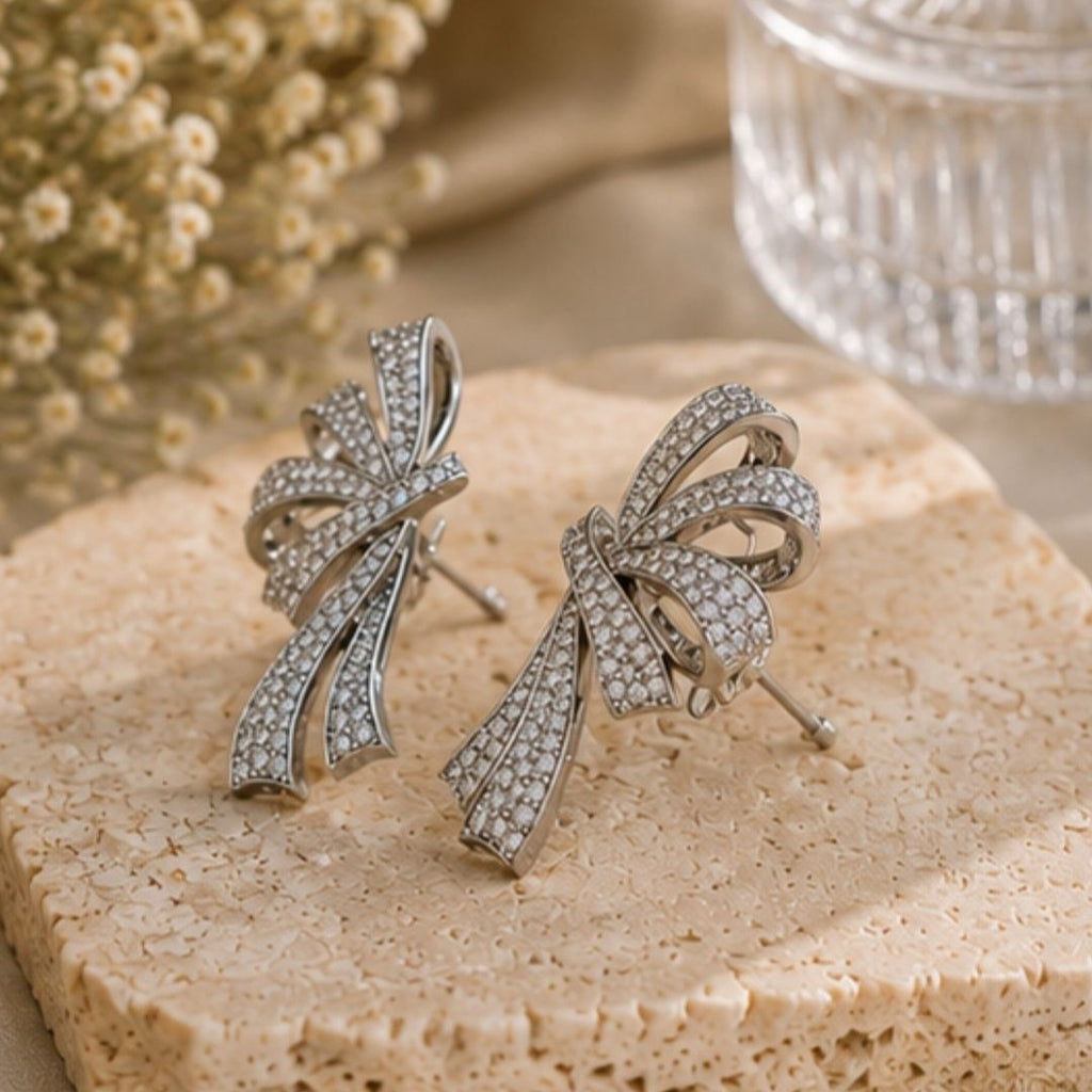 Rhodium Plated Cubic Zirconia Bow Style Drop Earrings