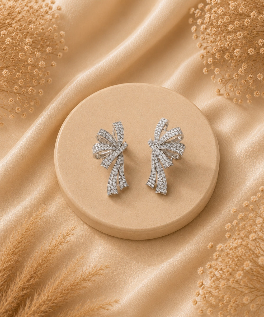Rhodium Plated Cubic Zirconia Bow Style Drop Earrings